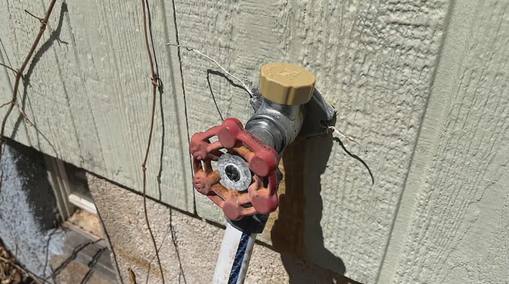 Outdoor faucet after vacuum breaker repair on an old house